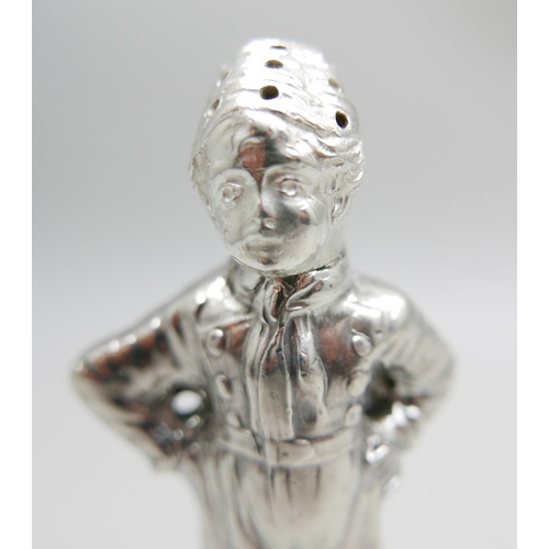 847 - A novelty continental silver pepper modelled as a young Dutch boy, marked HH, possibly Herbert Hooij... 