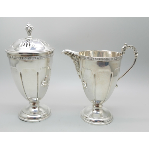 850 - A silver cream jug and a matching sugar shaker by Adie Bros., Birmingham 1935, 207g, (both bases a/f... 