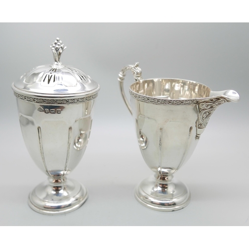 850 - A silver cream jug and a matching sugar shaker by Adie Bros., Birmingham 1935, 207g, (both bases a/f... 