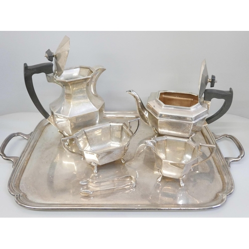 858 - A silver four piece tea service, two handled tray and a pair of silver sugar bows, Sheffield 1945 an... 