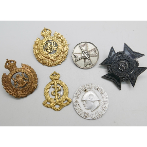 860 - A WWII Italian Fascist Youth 'Opera Balilla' badge, a German WWII War Merit medal, a Rhodesia Regime... 