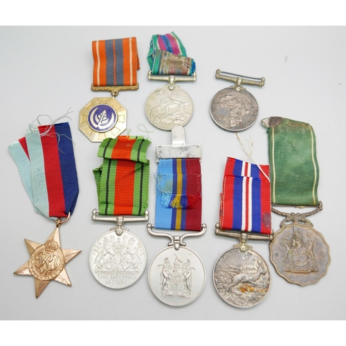 863 - Eight medals, including two Africa Service Medals to 592810 D.T. Howells and 133965 C.W. Chapman