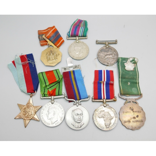 863 - Eight medals, including two Africa Service Medals to 592810 D.T. Howells and 133965 C.W. Chapman