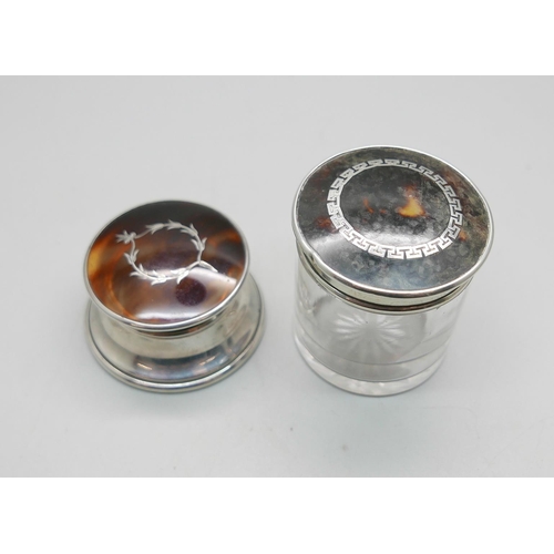 Two silver and tortoiseshell topped jars/pots, (glass jar 5cm)