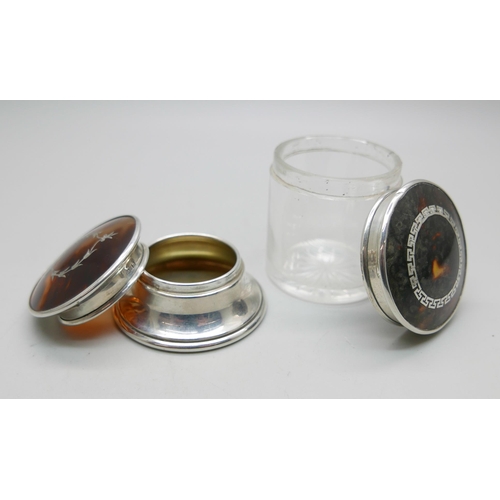 868 - Two silver and tortoiseshell topped jars/pots, (glass jar 5cm)