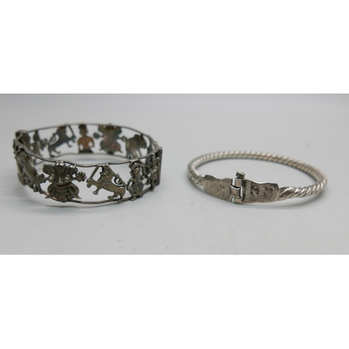 907 - One vintage eastern inspired silver bangle with temples, elephants, etc., and a silver cable hinged ... 