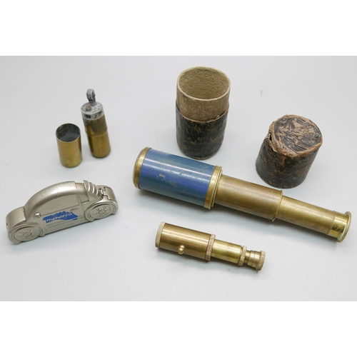 916 - A brass trench art type lighter, a pocket telescope, with case, and one other small telescope and a ... 