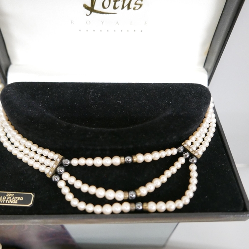 919 - Boxed pearls including Lotus and silver mounted