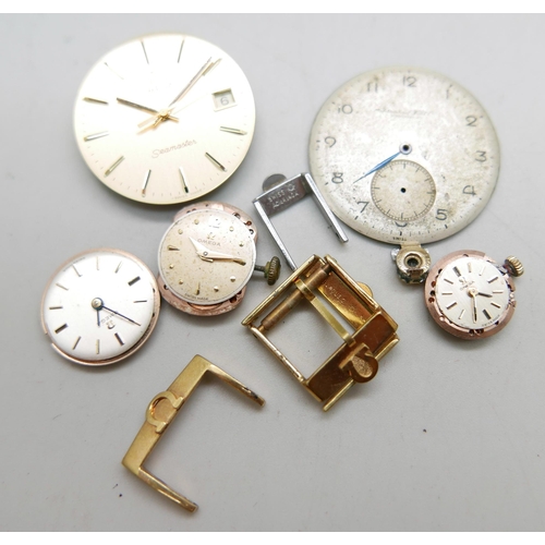 977 - Four Omega strap buckles, an International Watch Company watch dial, three lady's Omega watch moveme... 