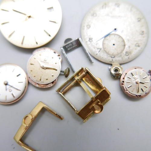 977 - Four Omega strap buckles, an International Watch Company watch dial, three lady's Omega watch moveme... 