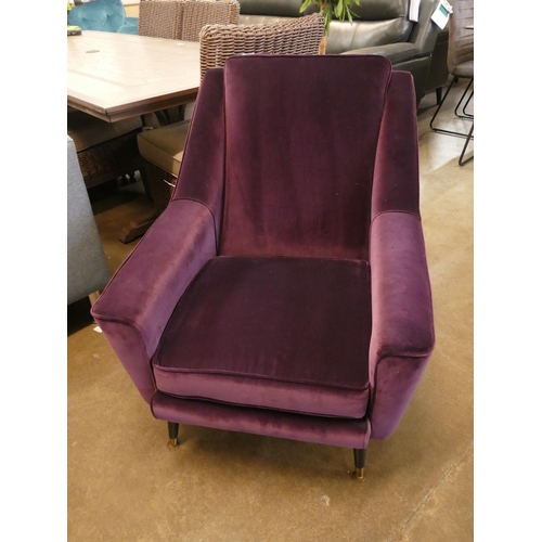 1308 - An aubergine velvet mid Century armchair