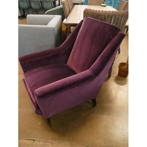 1308 - An aubergine velvet mid Century armchair