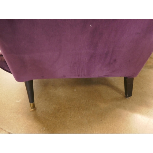 1308 - An aubergine velvet mid Century armchair