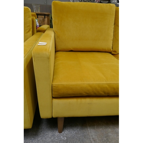 1447 - A turmeric velvet three seater sofa