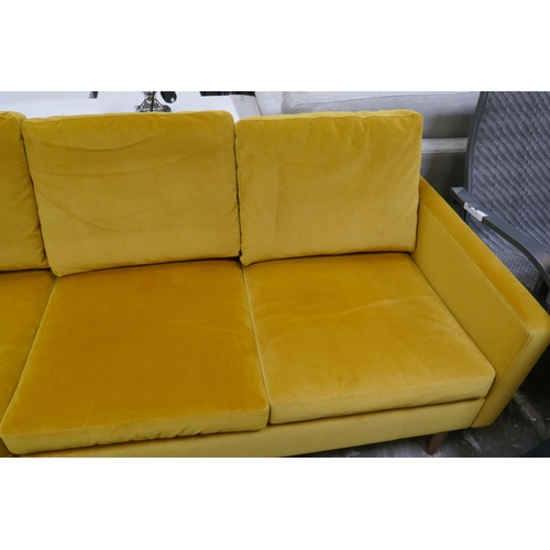 1447 - A turmeric velvet three seater sofa