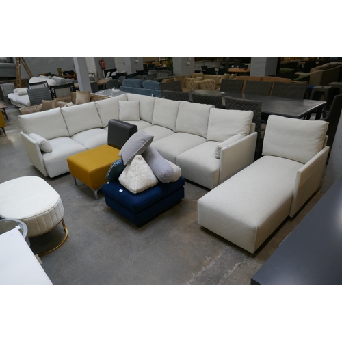 1471 - An oatmeal upholstered six section corner sofa with chaise section