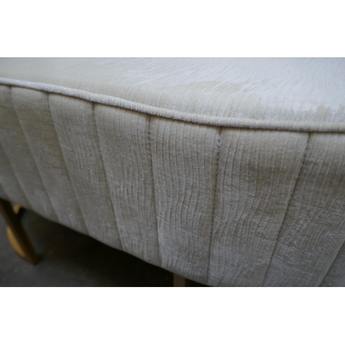 1477 - A cream upholstered stool wtih gold legs