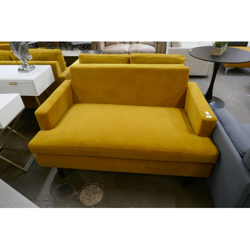 1483 - A turmeric velvet two seater sofa - missing back cushion