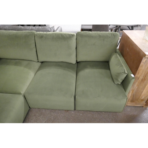 1499 - A green velvet four section corner sofa