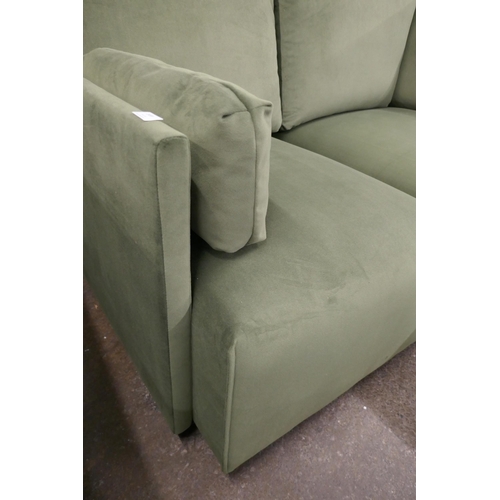 1499 - A green velvet four section corner sofa