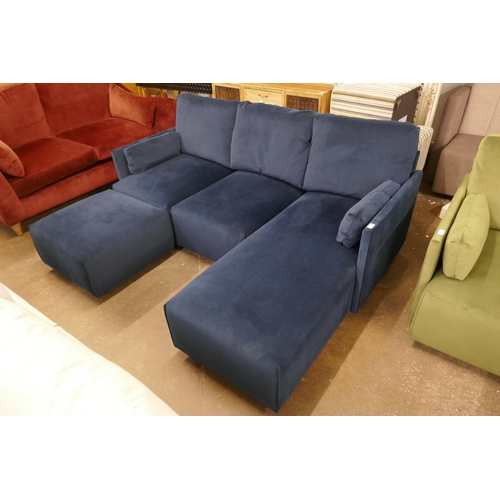 1500 - A blue velvet L shaped sofa and footstool