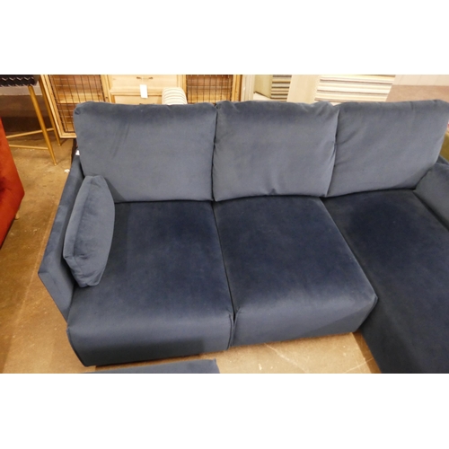 1500 - A blue velvet L shaped sofa and footstool