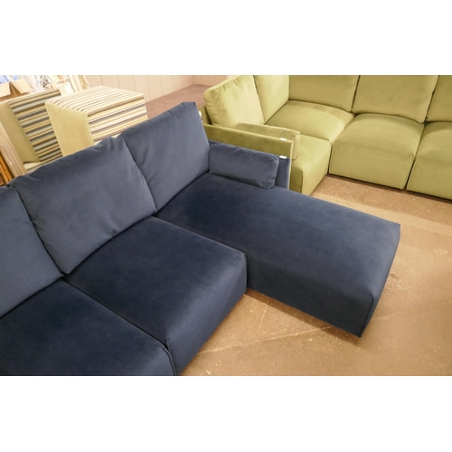 1500 - A blue velvet L shaped sofa and footstool