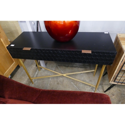 1510 - A black console table with gold legs