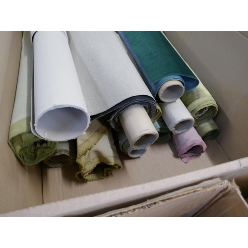 1582 - A box of upholstery fabric part rolls and roll ends