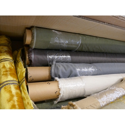 1583 - A box of upholstery fabric part rolls and roll ends