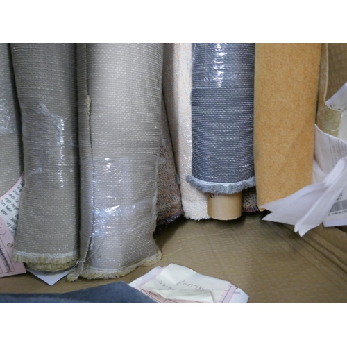 1587 - A box of upholstery fabric part rolls and roll ends