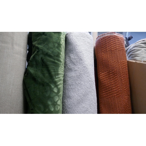 1590 - A large quantity of upholstery fabric part rolls and roll ends