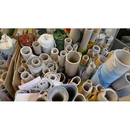 1590 - A large quantity of upholstery fabric part rolls and roll ends