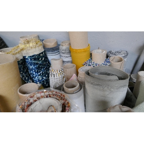 1599 - A large quantity of upholstery fabric part rolls and roll ends