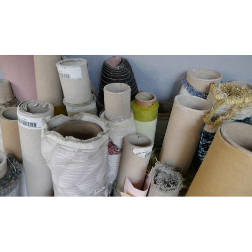 1599 - A large quantity of upholstery fabric part rolls and roll ends