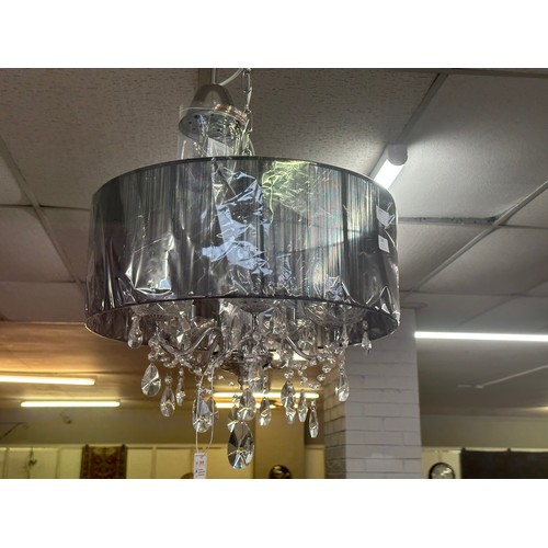 1394 - A chrome five armed chandelier with white shade