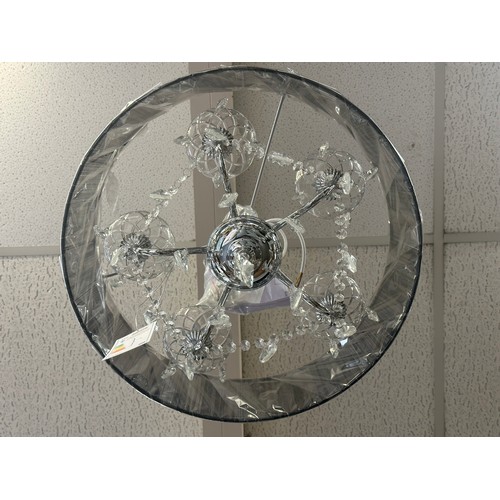 1394 - A chrome five armed chandelier with white shade