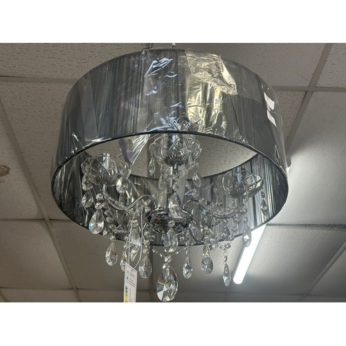 1394 - A chrome five armed chandelier with white shade