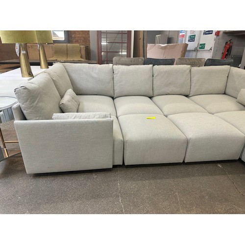 1481 - A grey linen eight section corner sofa