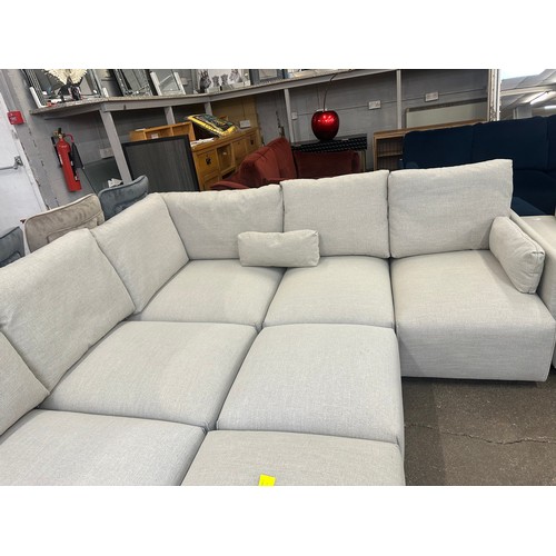 1481 - A grey linen eight section corner sofa