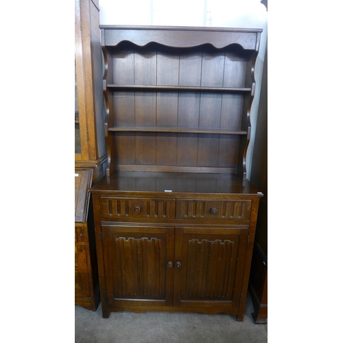 103 - A carved oak linenfold dresser