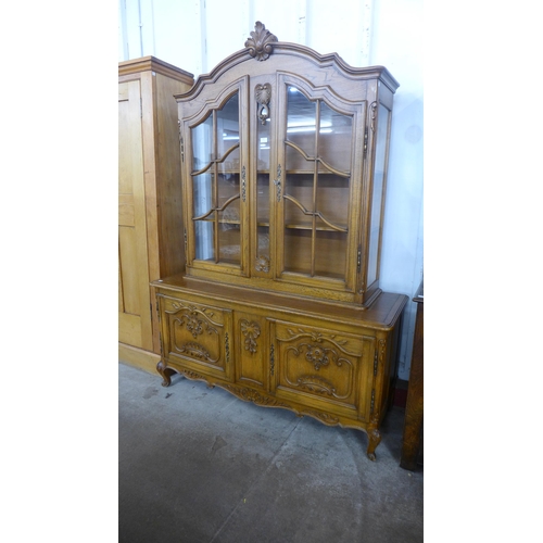 107 - A French Louis XV style carved oak bookcase