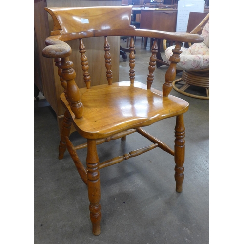 116 - A Victorian elm and beech smokers bow chair