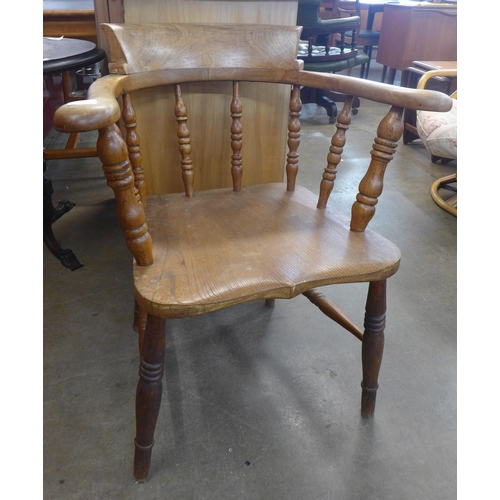 117 - A Victorian elm and beech smokers bow chair