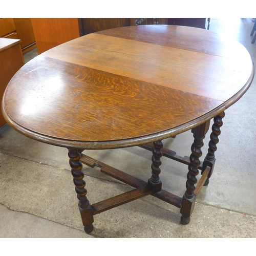 134 - An oak barleytwist gateleg table