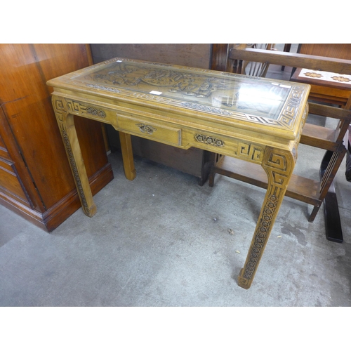 139 - A Chinese carved hardwood console table