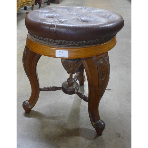 155 - A Victorian carved walnut and leather topped stool