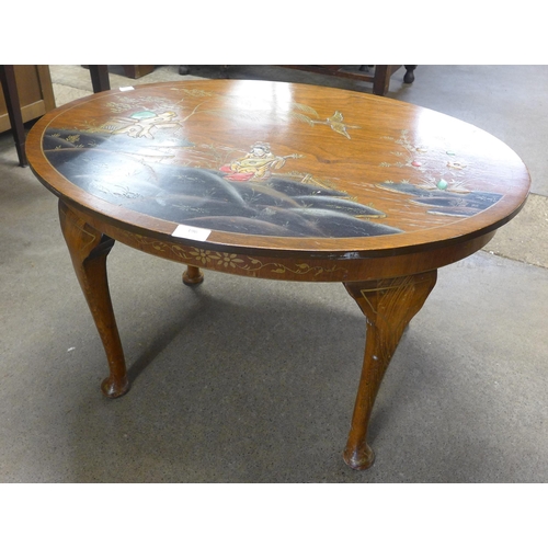 196 - A Japanned walnut oval coffee table