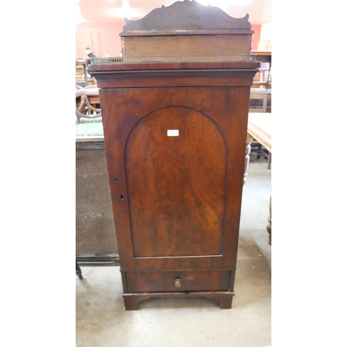 213 - A Victorian mahogany single door cupboard