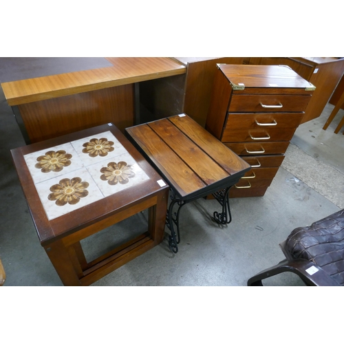 343 - A small oak effect chest of drawers and two nests of tables